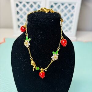 Kate Spade bracelet with with Strawberry Charms & crystal flowers. NWT. 7”-8.5”
